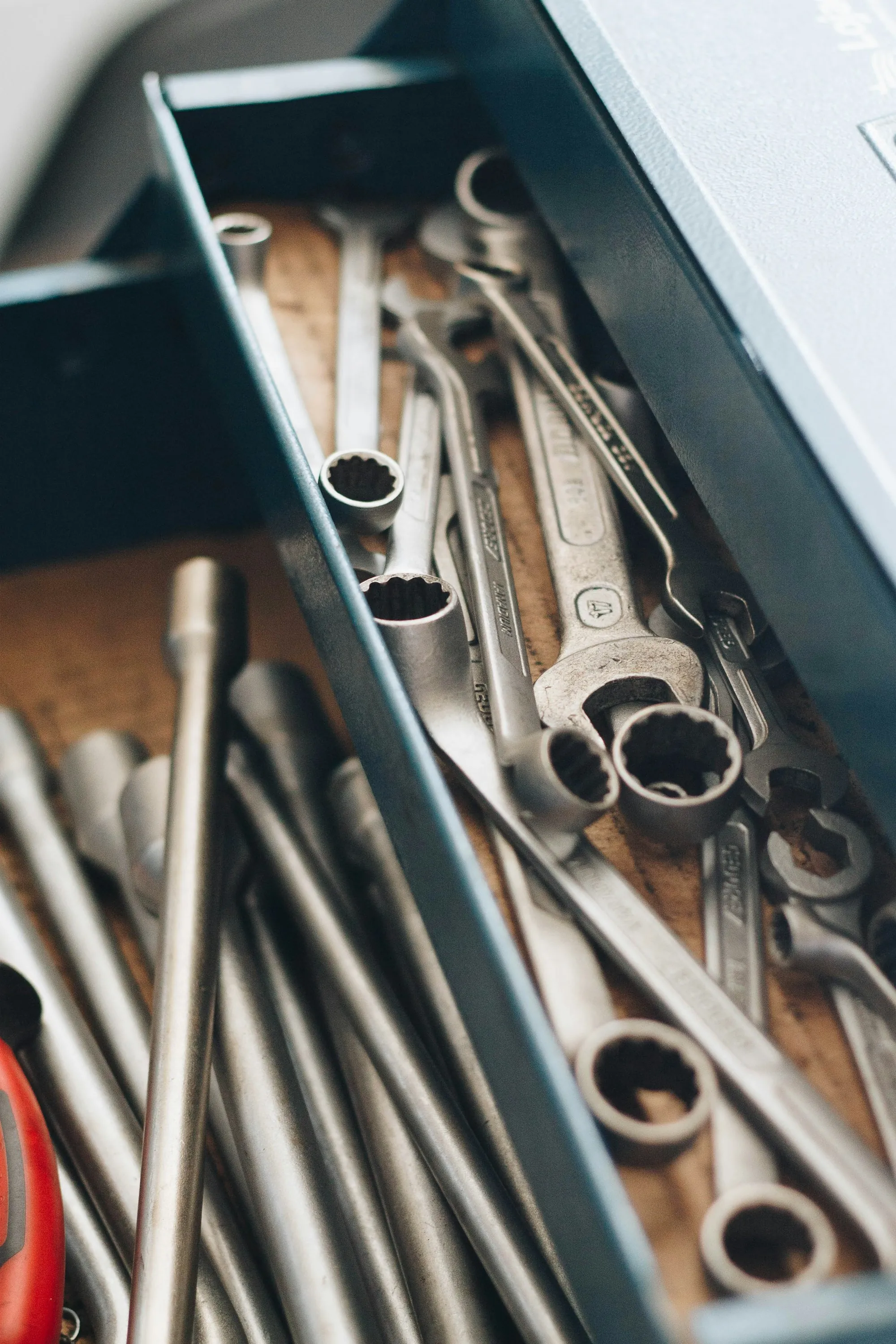 Close view of combination wrenches in a tool drawer